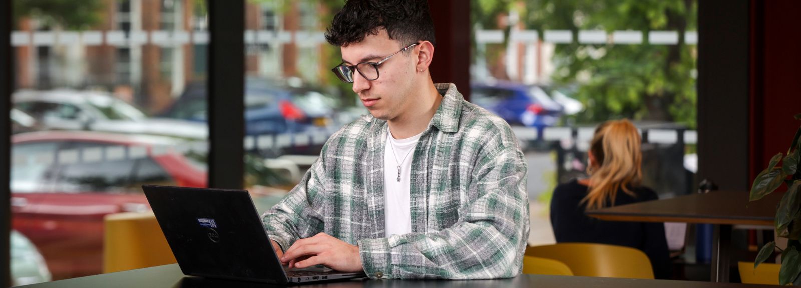 male student on laptop